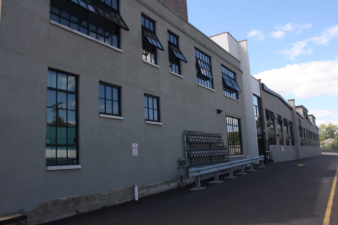 The main building of the former Roberts and Mander stove works in Hatboro, Pennsylvania, a long multi-story industrial building on the street.