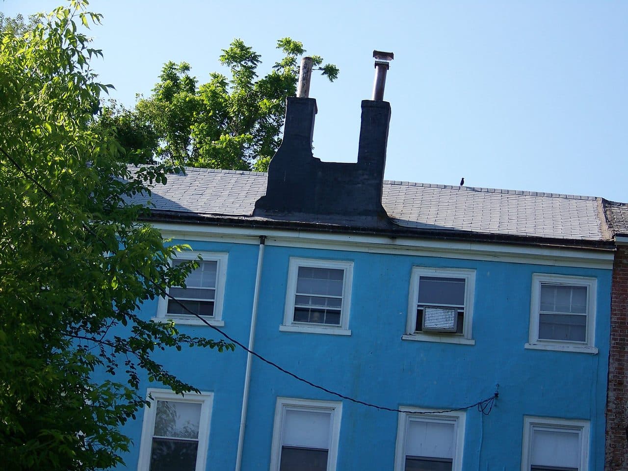 White Hall, the surviving building of the former Bristol College, a tall blue stuccoed building with twin chimneys in Croydon, Pennsylvania.